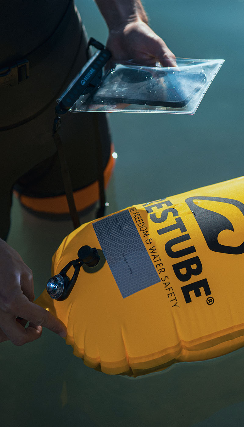 Close-up of a yellow RESTUBE buoy with reflective patch and light – thoughtful features for greater visibility.