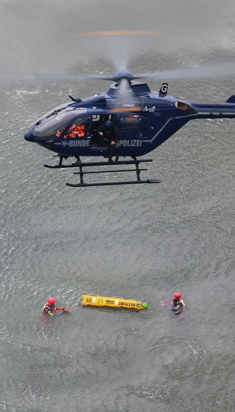 German Federal Police rescue mission with helicopter over water – RESTUBE Pro buoy in professional use.