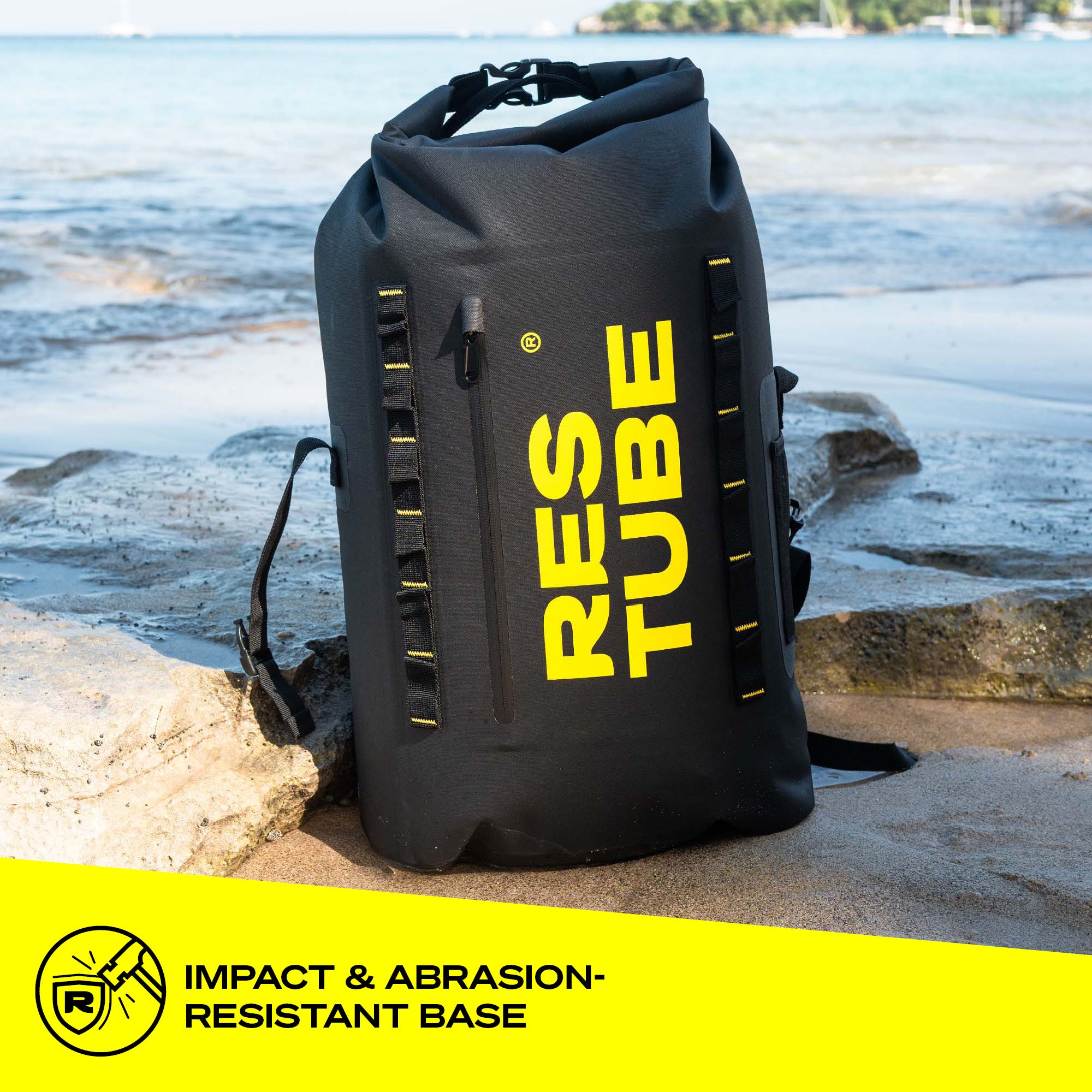 RESTUBE COAST backpack on rocks by the ocean – impact-resistant and abrasion-proof base