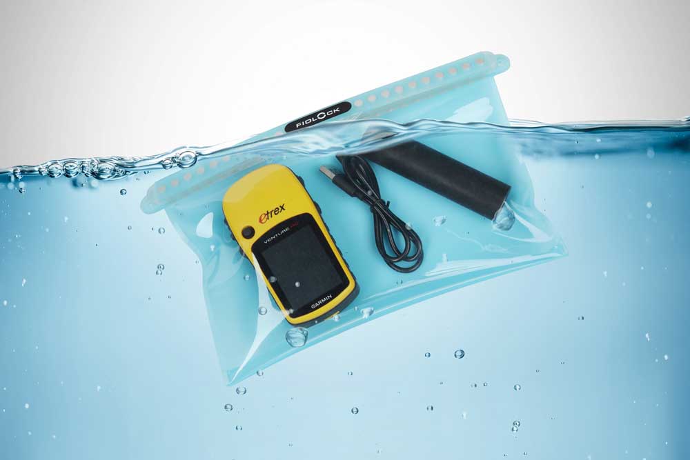 A white waterproof pouch with GPS device and a cable underwater – RESTUBE accessory for outdoor use.