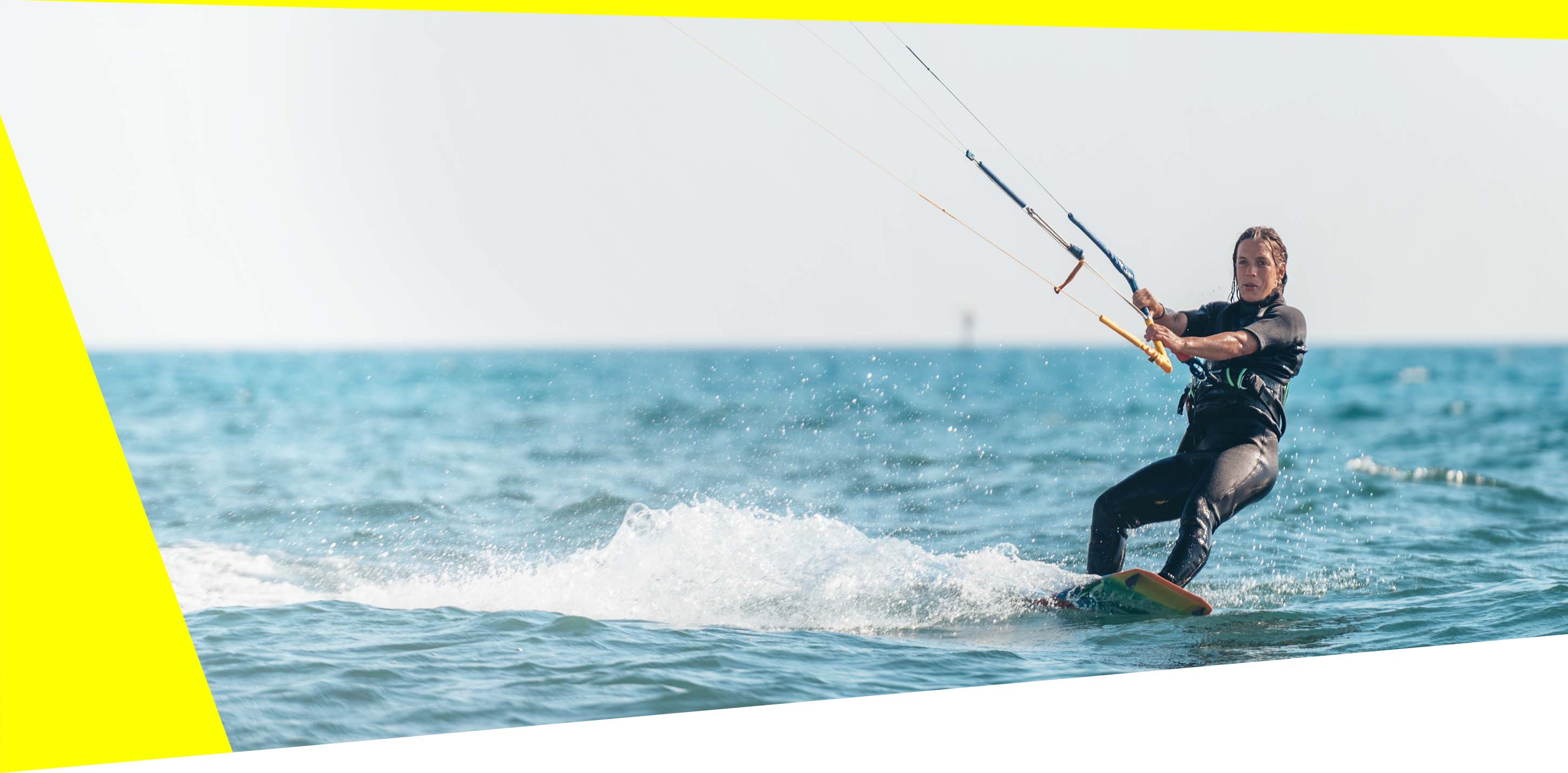 Kitesurfer on the water with RESTUBE buoy – for more safety and freedom in sports.