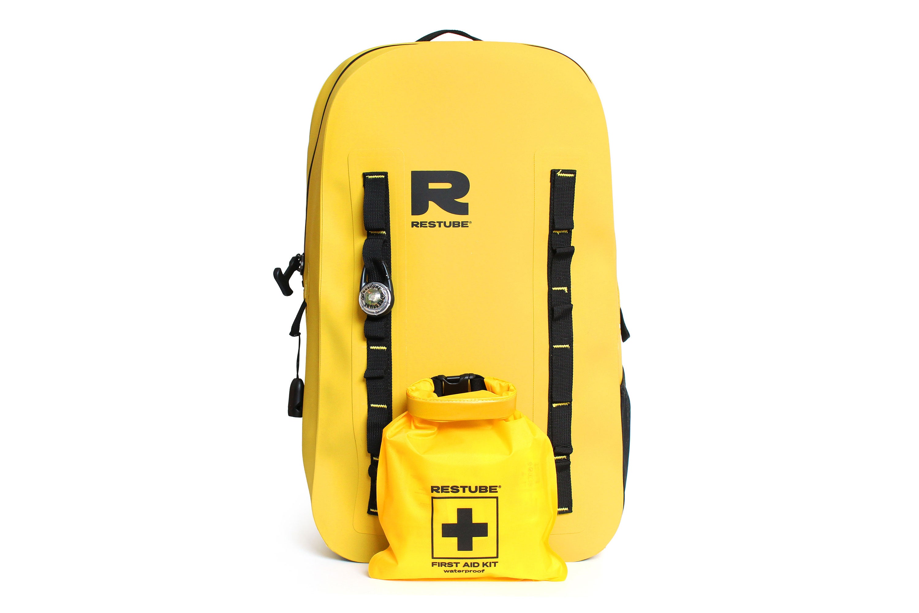 Front view of yellow waterproof backpack with attachment loops, mounted accessories and waterproof first aid kit attached to the front