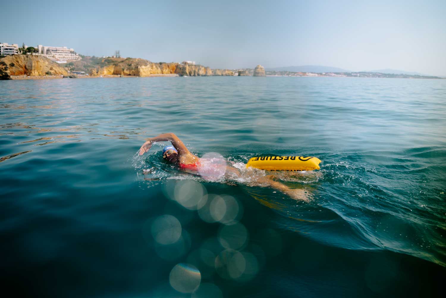 Nathalie Pohl swimming with the Restube active in the ocean