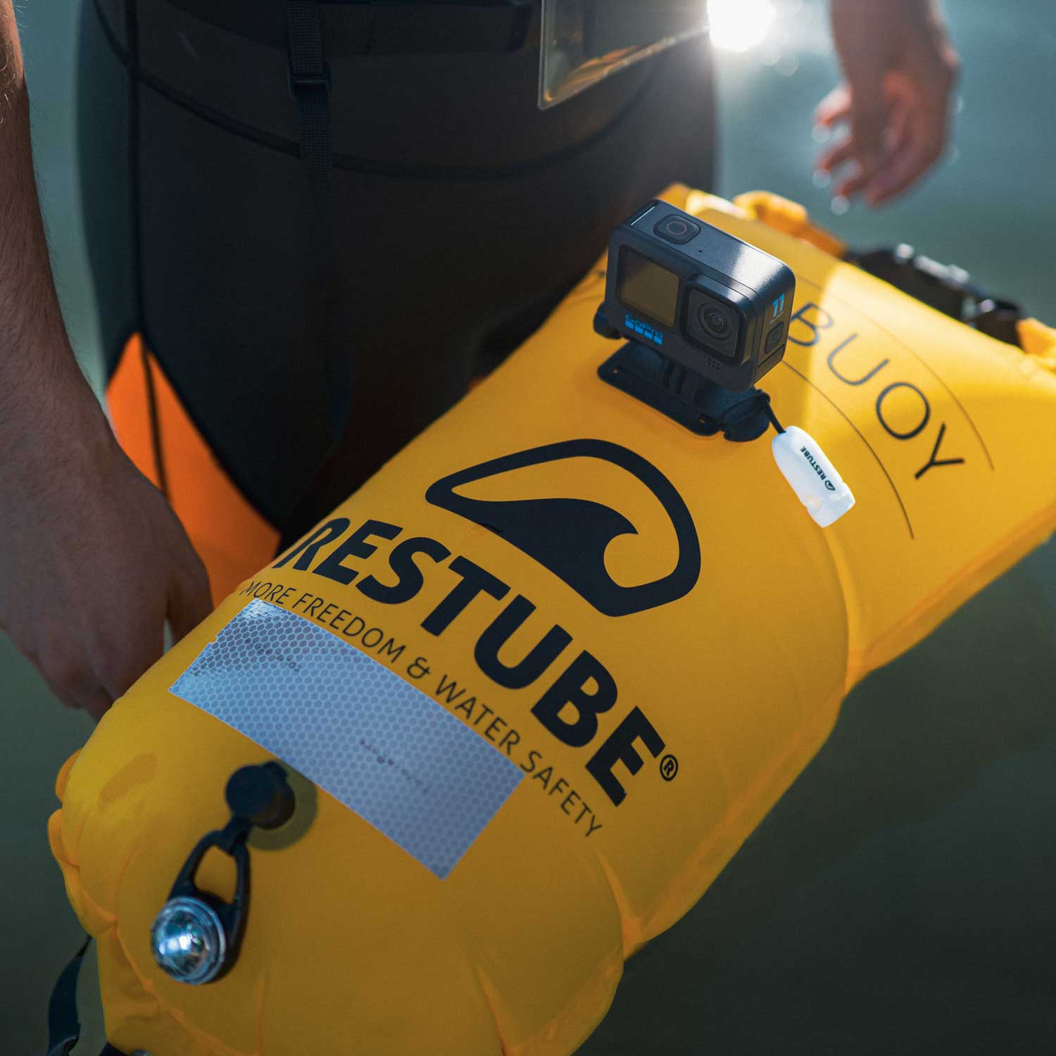 Inflatable RESTUBE swim buoy with mounted action cam – perfect for water adventures.