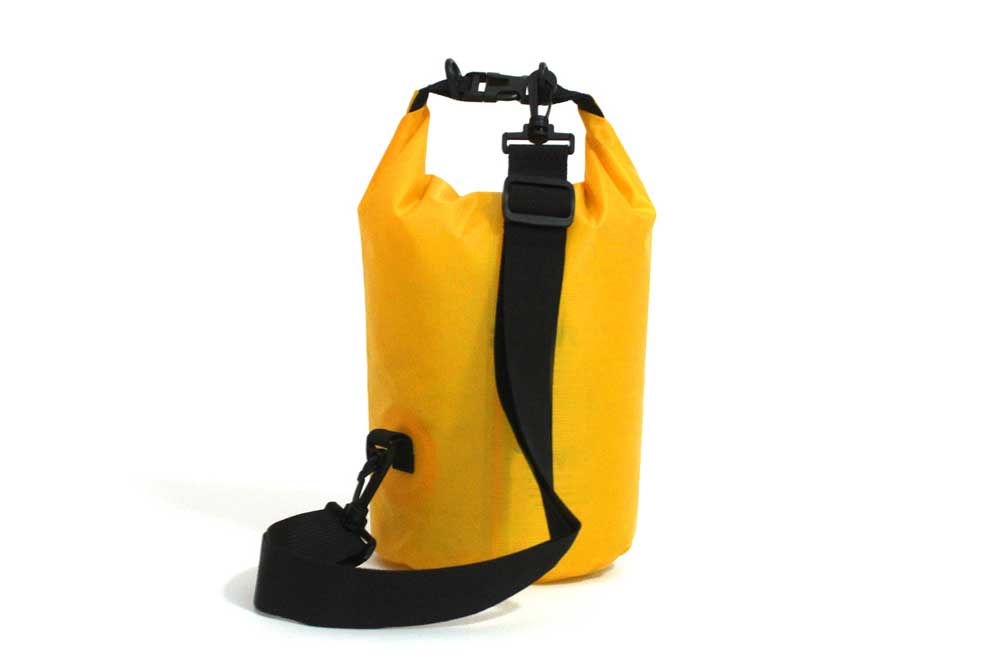 Yellow waterproof Drybag with black shoulder strap – for outdoor use.