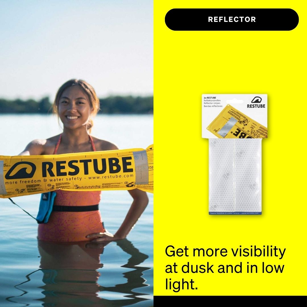 Woman standing in the water holding a RESTUBE Safety Buoy with attached reflector strips; product packaging of RESTUBE reflector strips shown on a yellow background with the text “Get more visibility at dusk and in low light.”